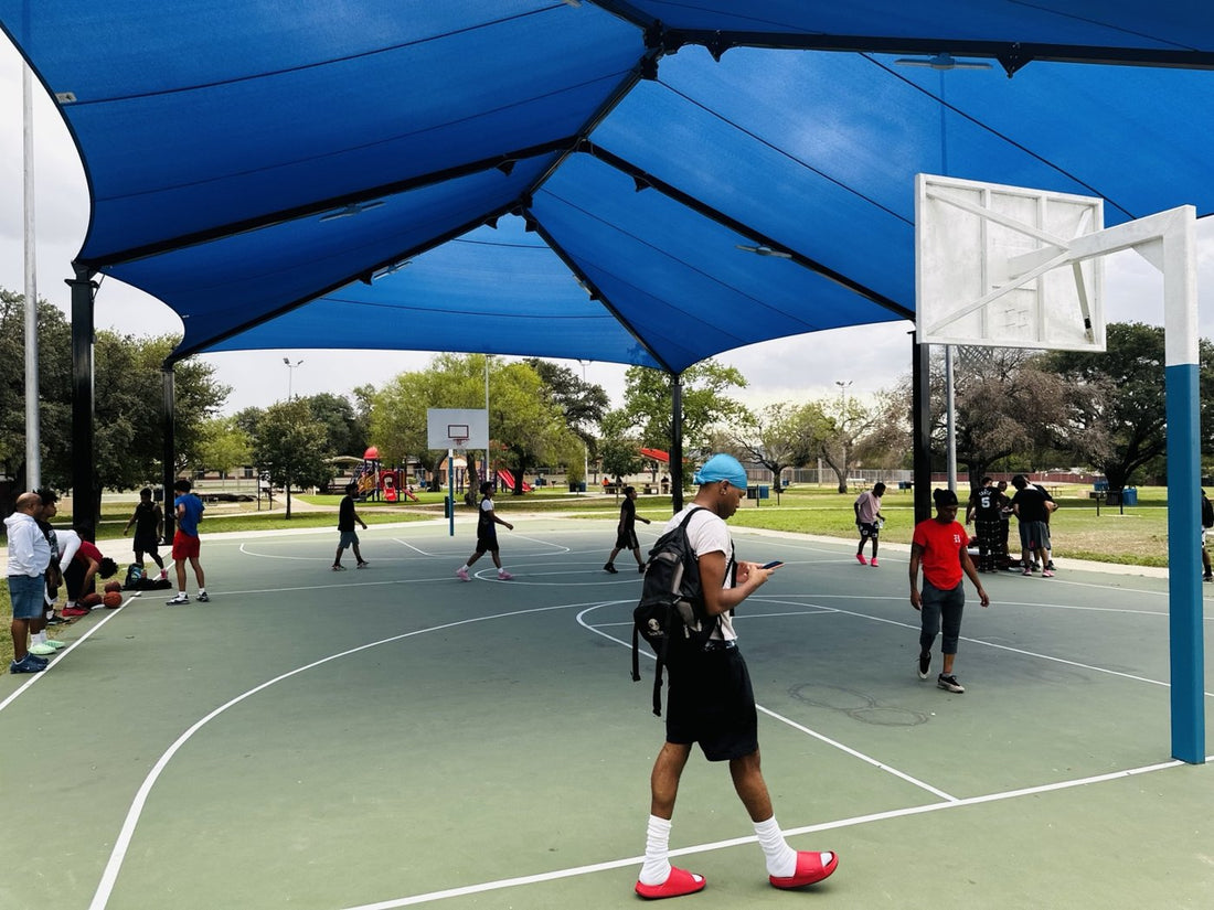 Basketball under the blue canopy at Palo Alto Park.